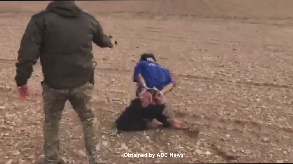 PHOTO: Cpl. Haider Ali sent Arkady a video showing Capt. Omar Nazar and Cpl. Haider Ali executing a bound prisoner.
